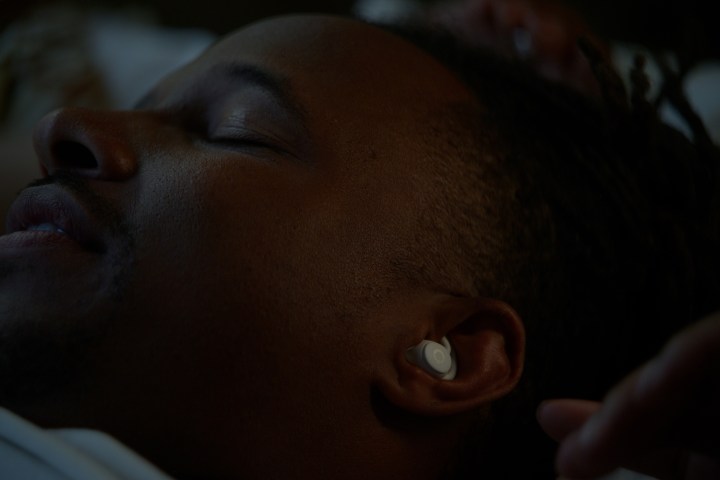 A person wearing the Ozlo Sleepbuds.