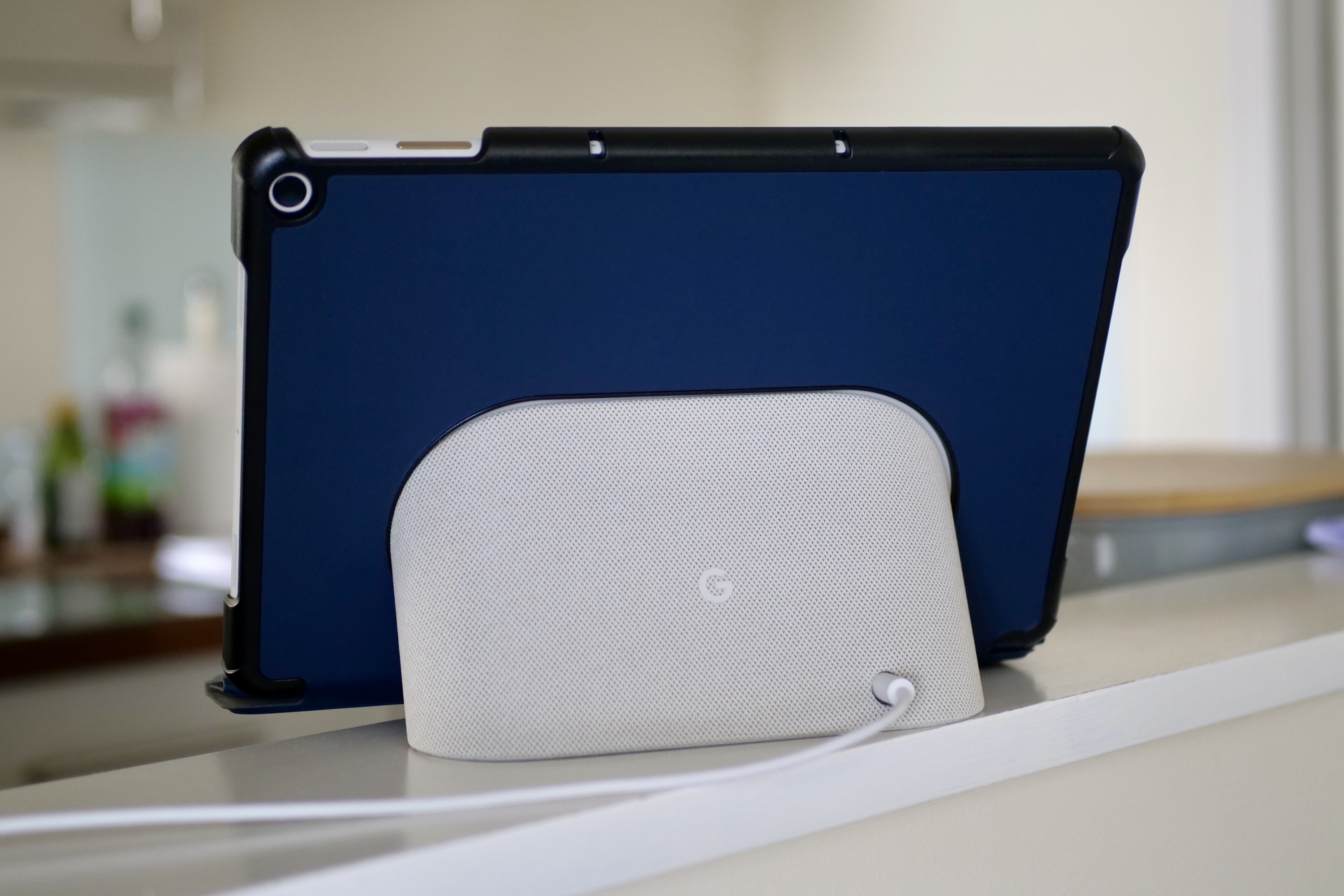 The back of the Pixel Tablet on its dock, with a case fitted.