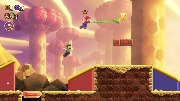 Mario swings ahead with a vine in Super Mario Wonder.