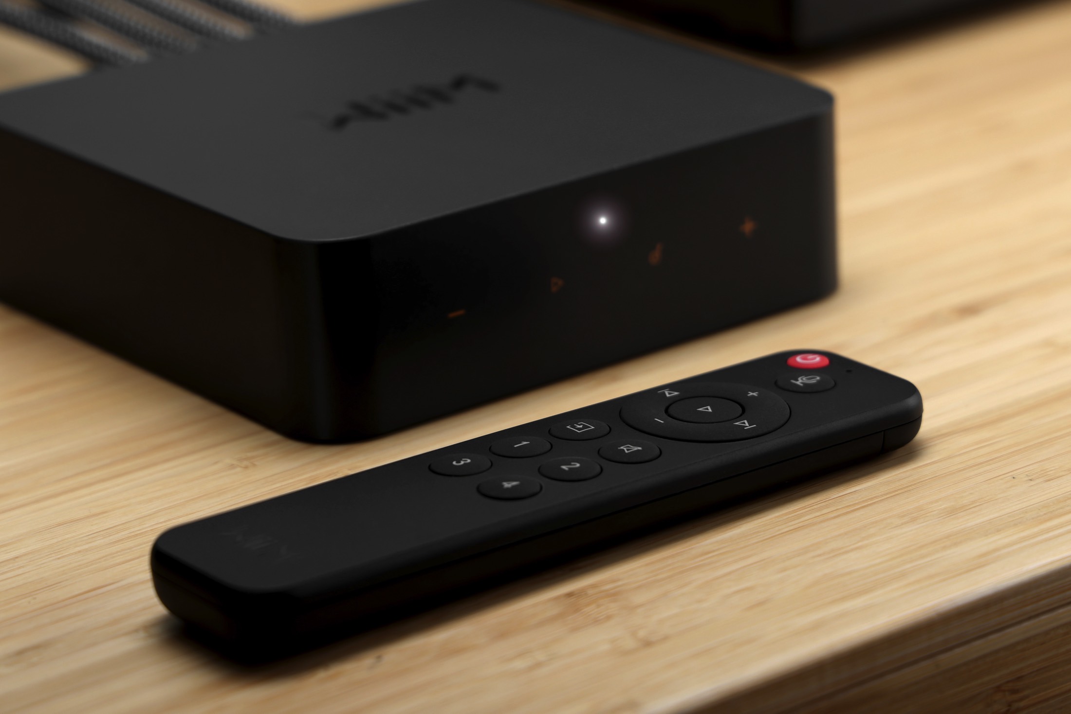 Wiim Pro Plus network music streamer with Bluetooth voice remote.