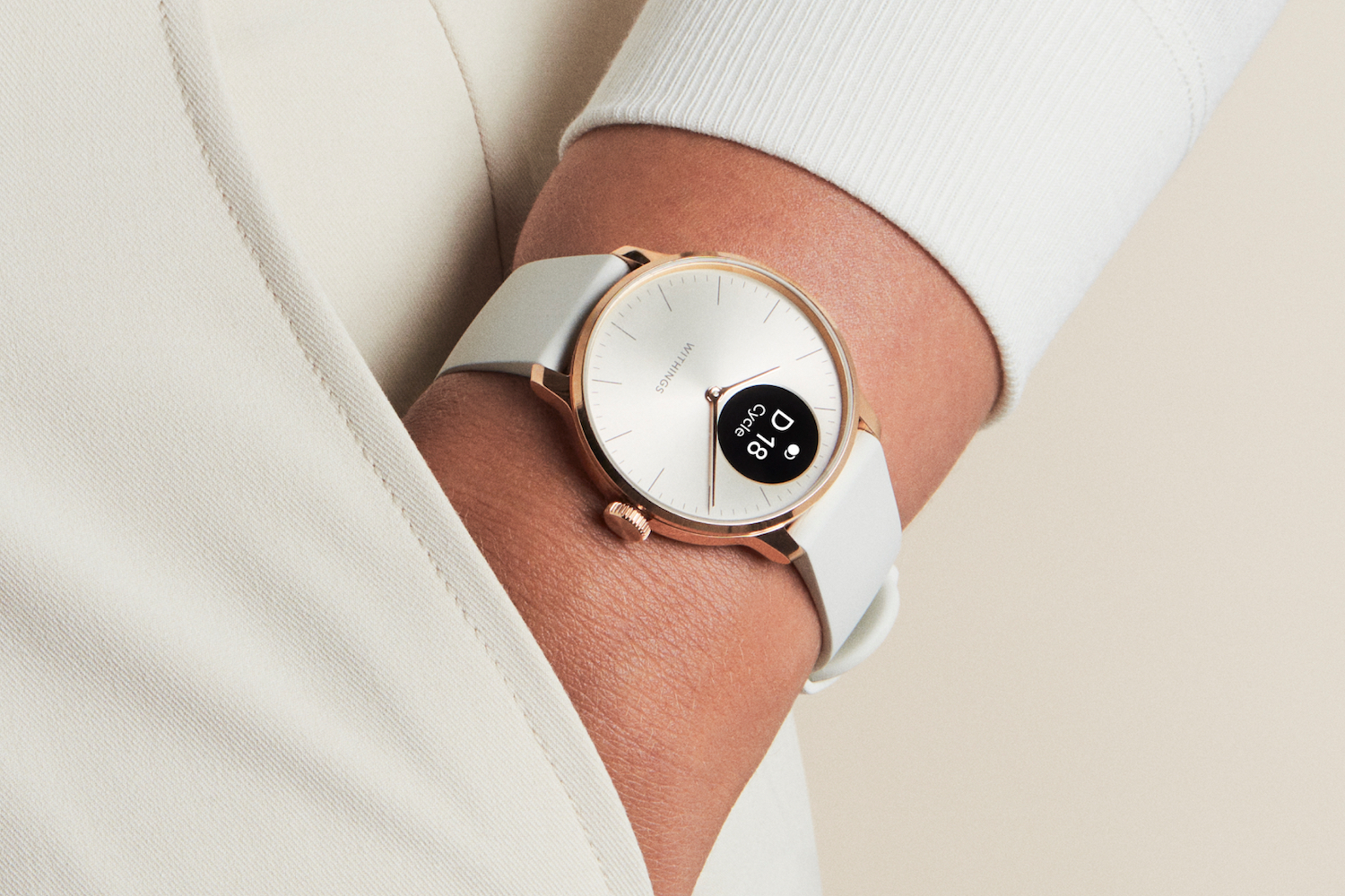 A person wearing the Withings ScanWatch Light.