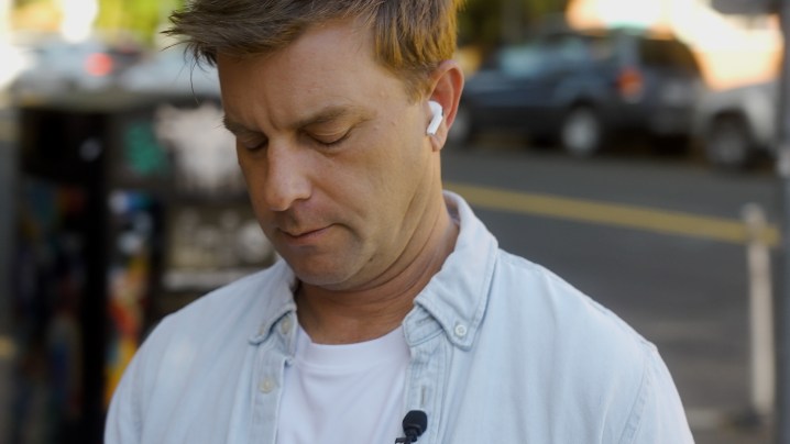 A man wearing the Apple AirPods Pro 2 with USB-C and MagSafe.