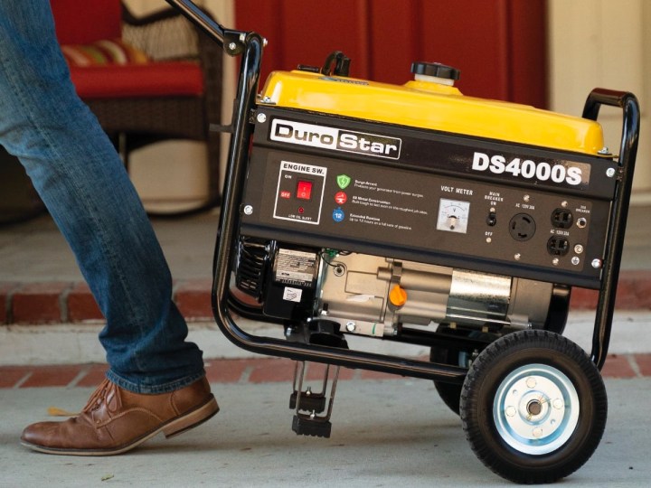 Using the handle to pull the DuroStar DS4000S 4000-Watt 208cc Air Cooled OHV Gas Engine Portable RV Generator.