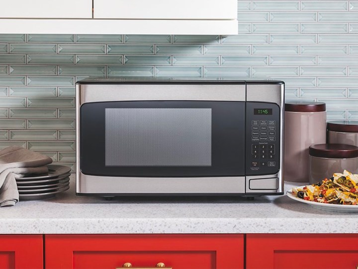 The GE 1.1 cu. ft. microwave on a countertop.