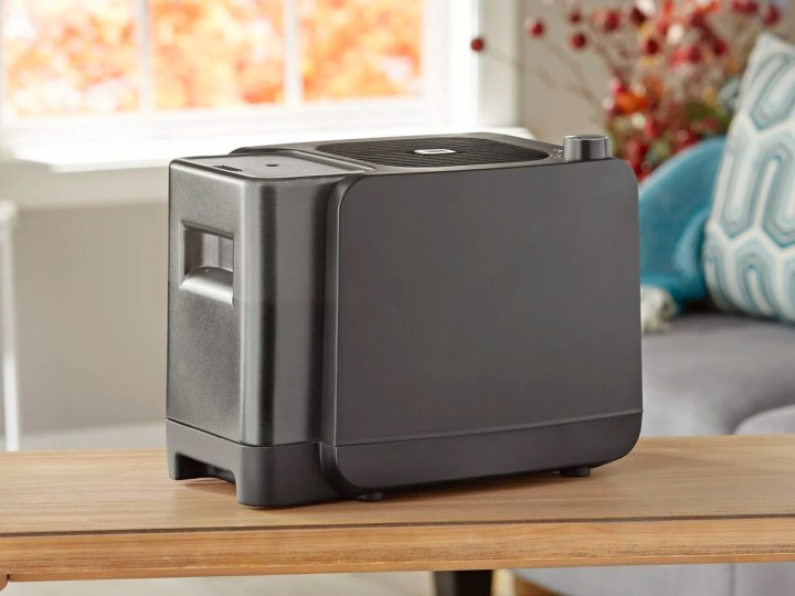 The Mainstays 1-gallon humidifier sets on a table in a kitchen.