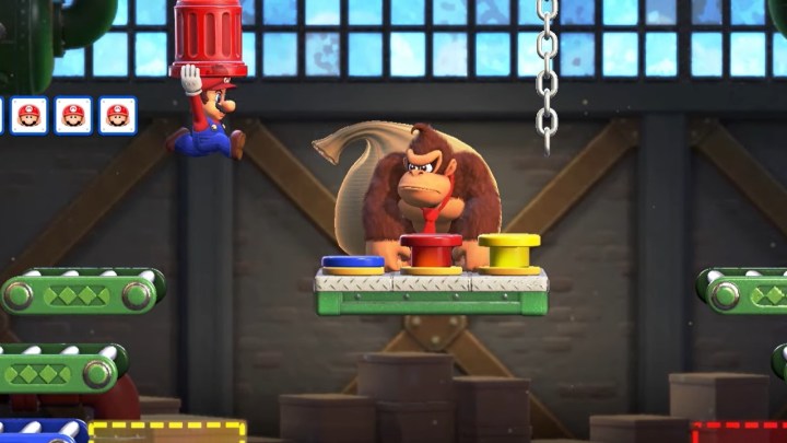 Mario jumping towards Donkey Kong in Mario vs Donkey Kong for the Switch.