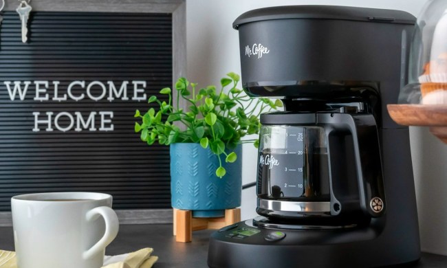 The Mr. Coffee 5-cup coffee maker on a kitchen stand.