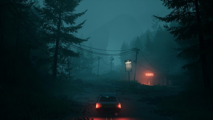 A car drives along an overgrown road, an abandoned gas stations illuminates the background. 