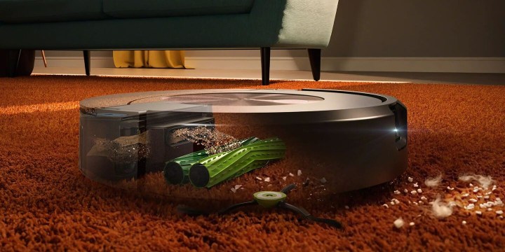The Combo j9+ vacuuming with a transparent chassis showing its internal components.