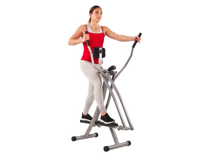 A woman works out with the Sunny SF-E902 Air Walk elliptical machine.