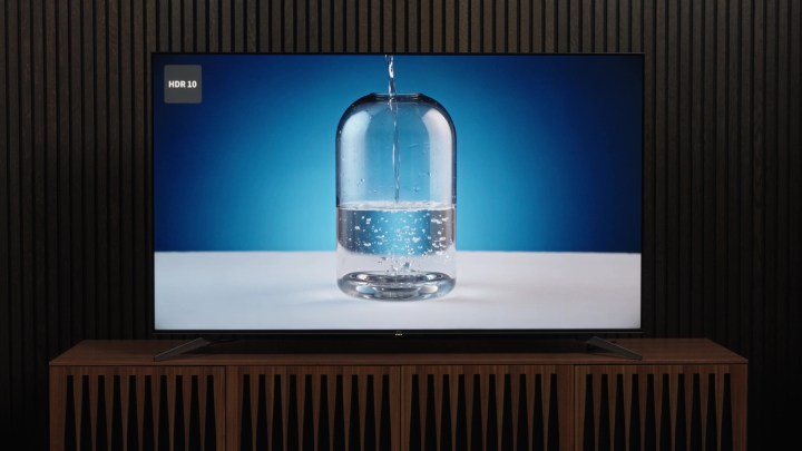 Bubbles form in a carafe of water being filled slowly as shown on a TCL Q7 TV.