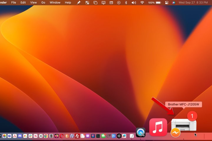The Mac shows a printer icon in the dock when there's a problem.