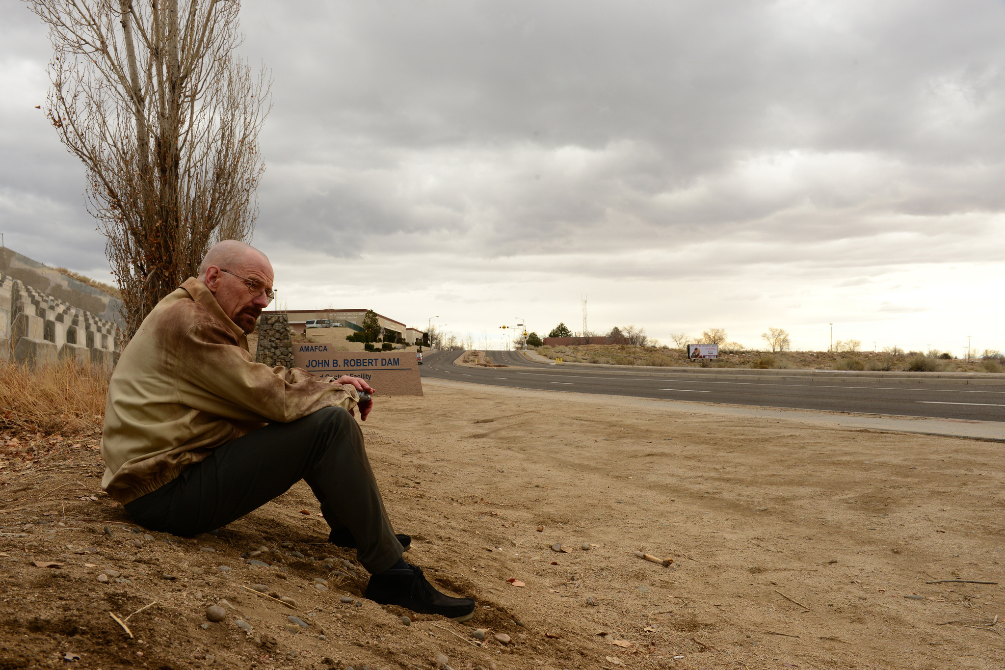 Walter White sits by the side of the road in Breaking Bad season 5.
