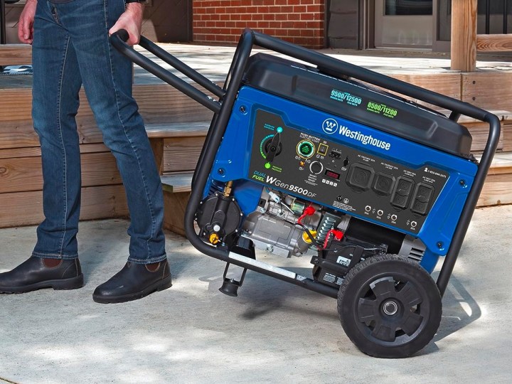 Using the handle to move the Westinghouse Outdoor Power Equipment 12500 Peak Watt Dual Fuel Home Backup Portable Generator.