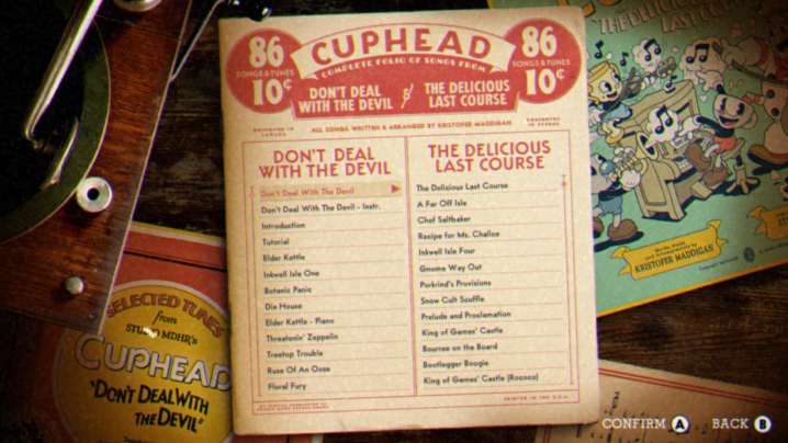 Una lista de pistas musicales de Cuphead se encuentra sobre una mesa.