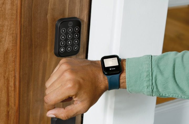 A person opening the Yale Assure Lock 2 with their Apple Watch.