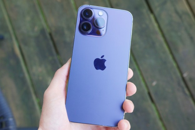 Someone holding a Deep Purple iPhone 14 Pro Max, showing the back of the phone.