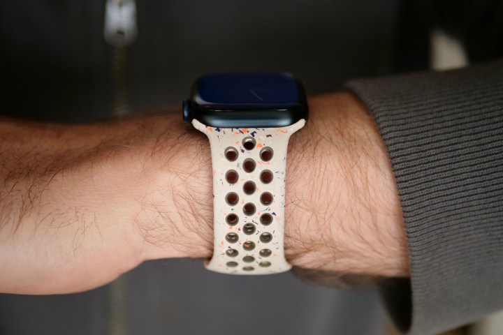 The Apple Watch Series 9 seen from the side on a person's wrist.