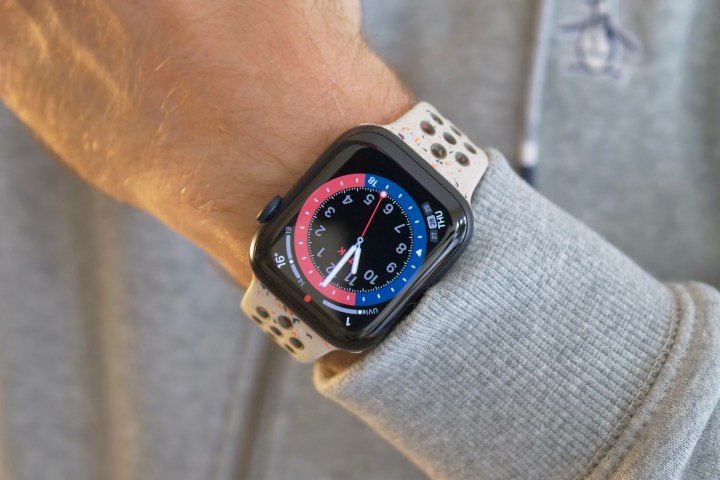 A personification wearing nan Apple Watch Series 9.