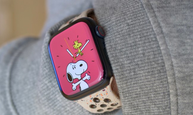 A person wearing the Apple Watch Series 9, showing the Snoopy watch face