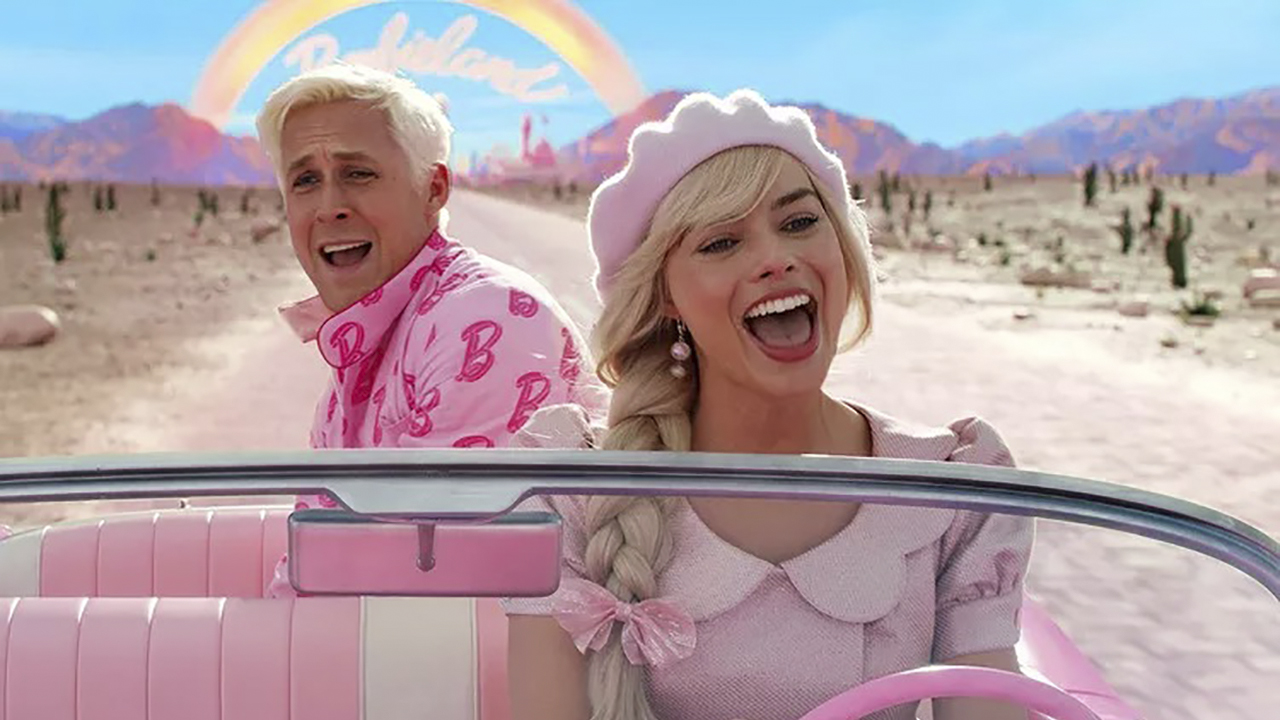 Barbie and Ken singing and driving in a pink car in a scene from Barbie.