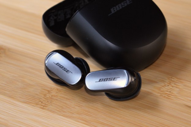 Bose QuietComfort Ultra Earbuds in front of charging case.