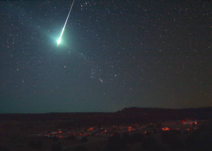An photo captures a bolide, or bright fireball, in the sky.