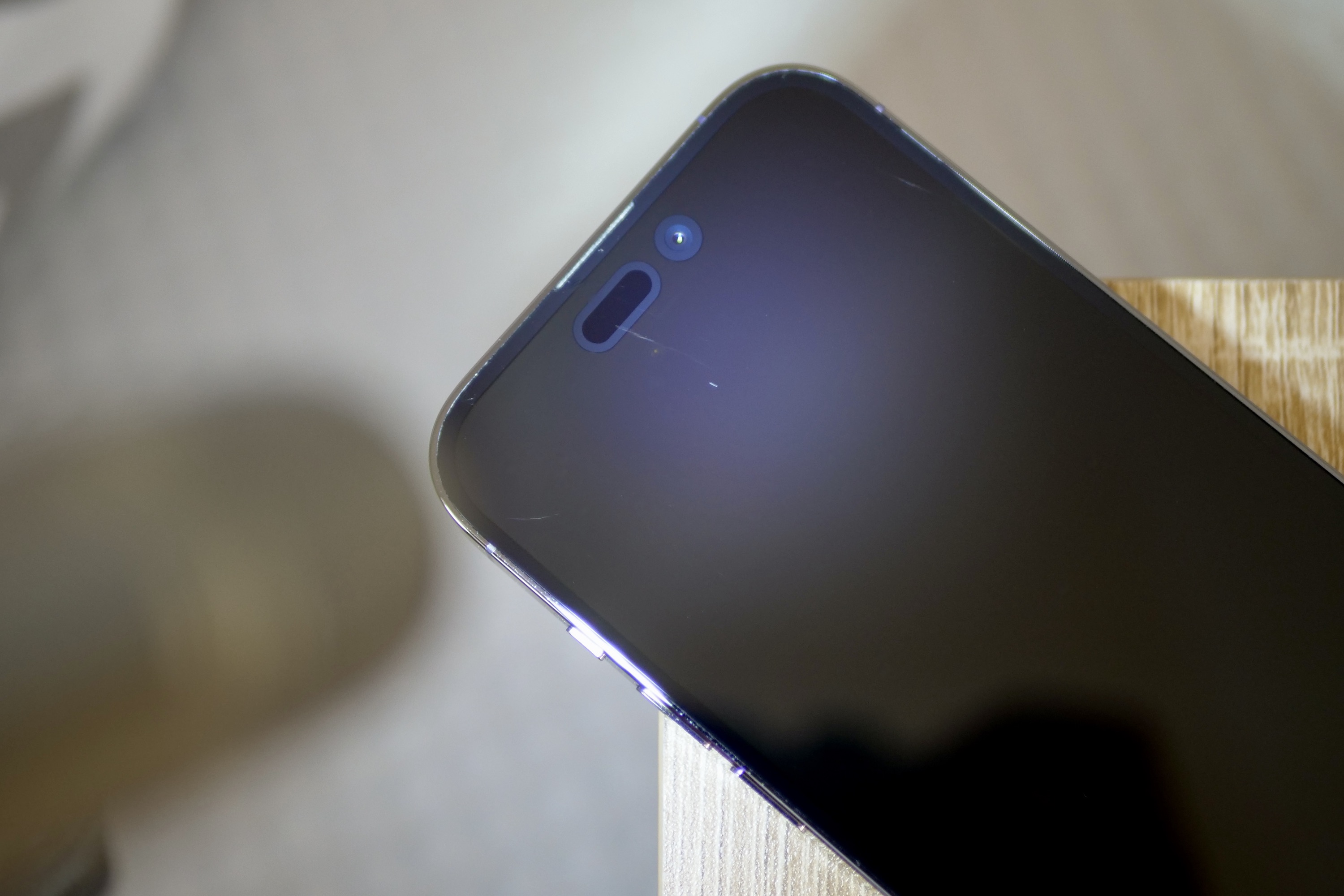 Ceramic Shield on the iPhone 14 Pro, with light to show scratches.