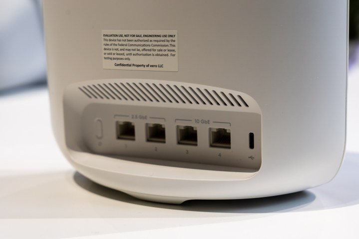 A rear view shows ethernet ports on the back of the Eero 7 Max.