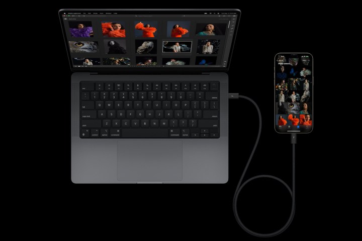 A promotional image showing an iPhone 15 plugged into a MacBook using USB C.