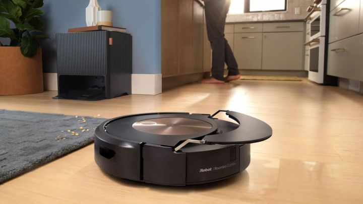 The iRobot j9+ cleaning a floor and retracting its mop.