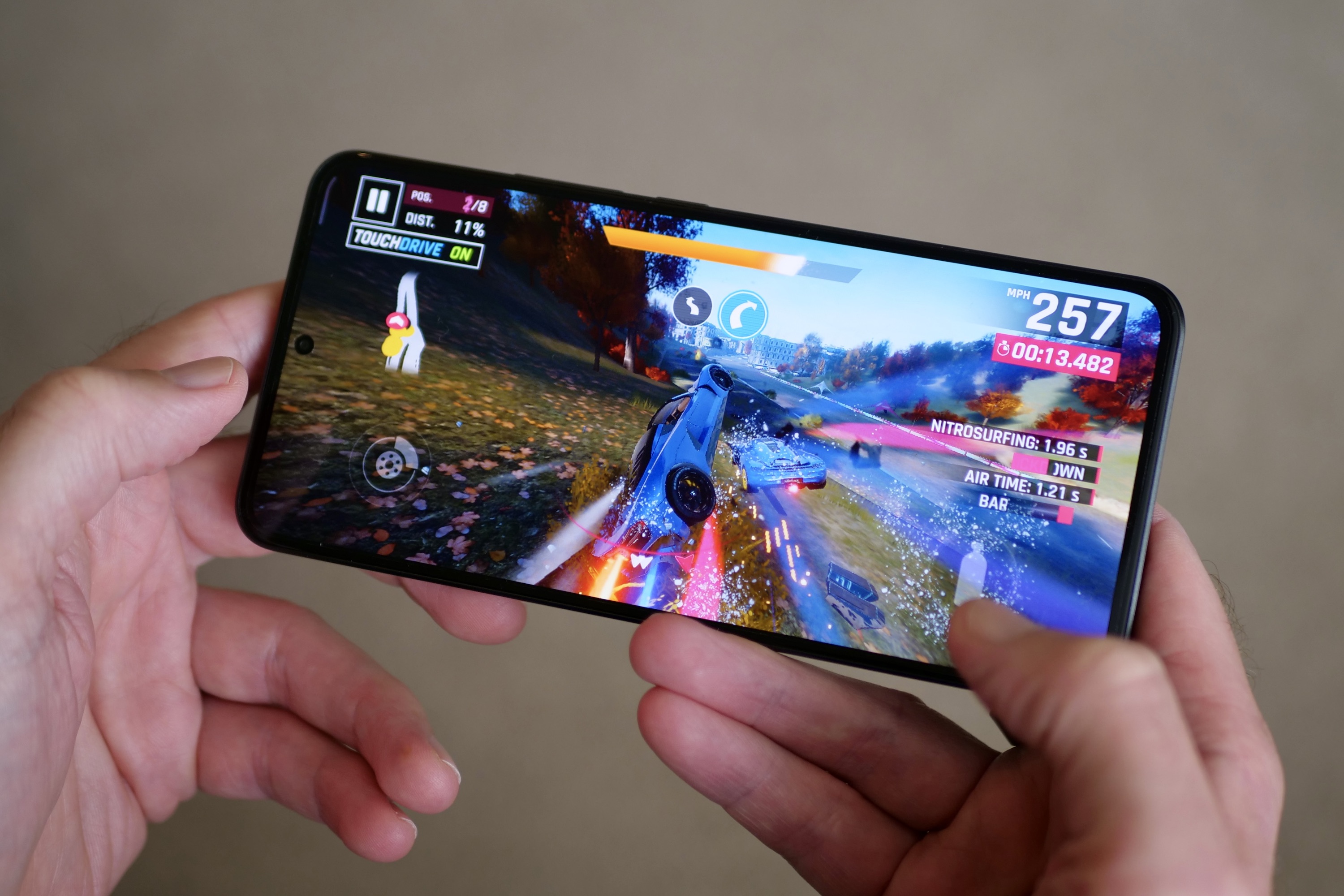 A person playing a game on the Xiaomi 13T Pro.