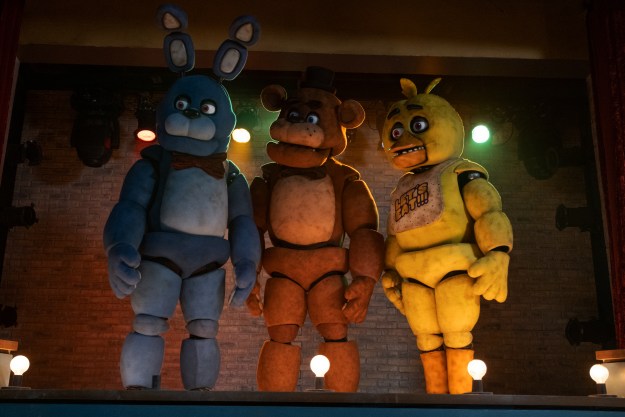 Bonnie, Freddy, and Chica stand on a stage together in Five Nights at Freddy's.