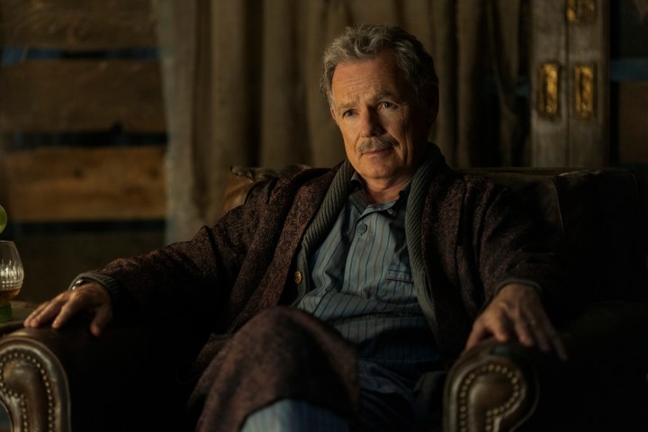 Bruce Greenwood sits in a chair in The Fall of the House of Usher.