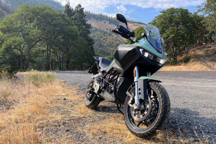 A 2023 Zero DSR-X electric adventure motorcycle sits parked on the side of the road.