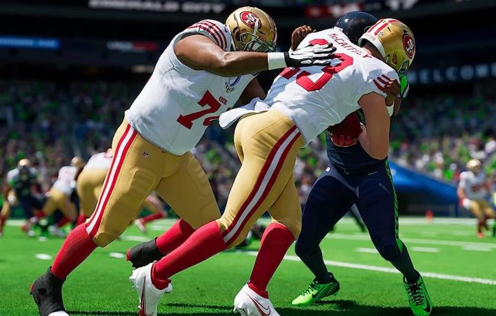 Players make a tackle in gameplay action of Madden NFL 24.