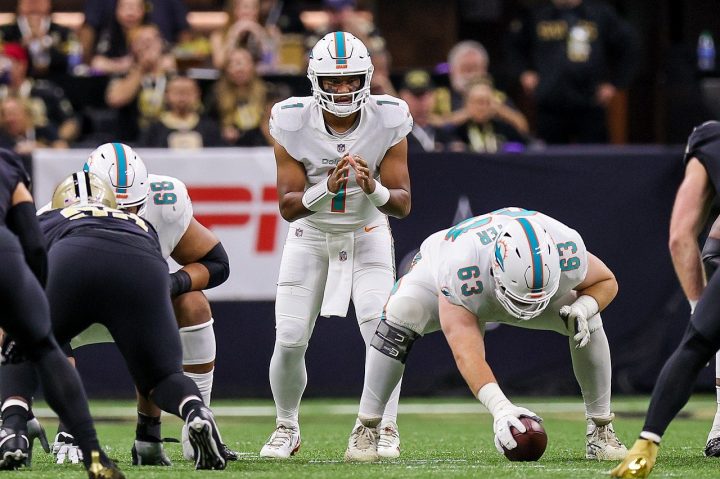 A quarterback lines up in the shotgun for the Miami Dolphins.