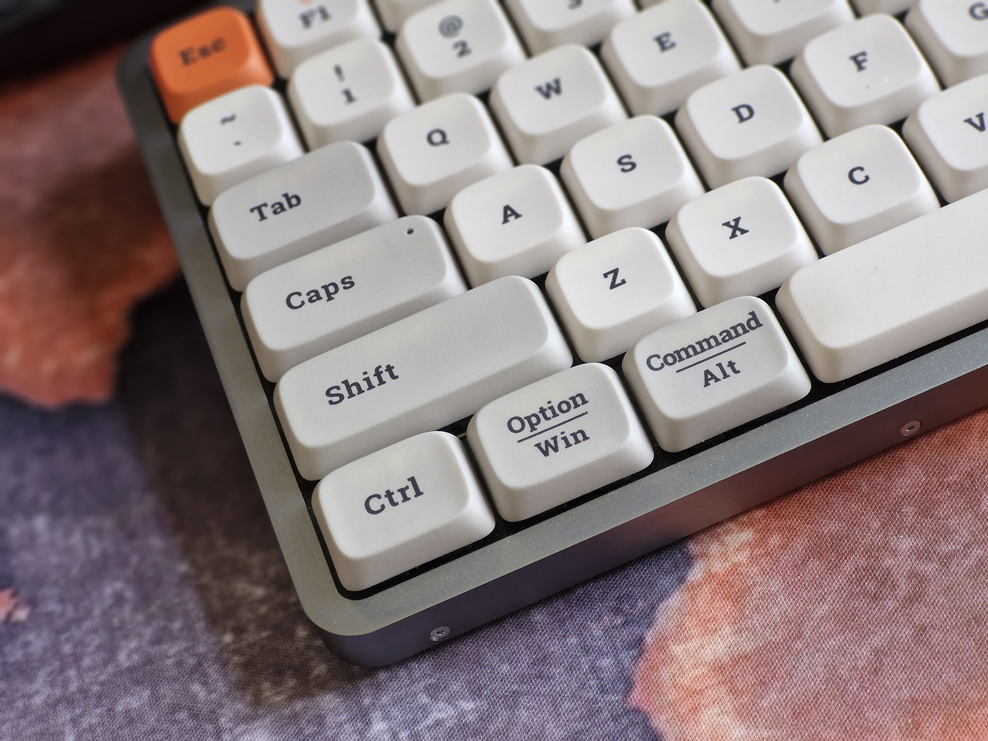 Low profile mechanical keyboard with retro keycaps photographed with the Samsung Galaxy S23 FE.
