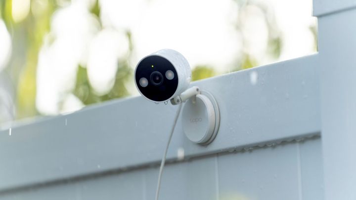 The Tapo C120 installed on a fence.