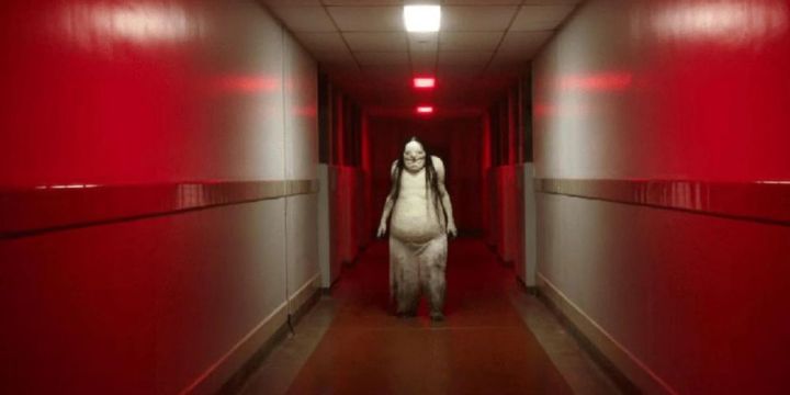 The Pale Lady walks down a hospital hallways