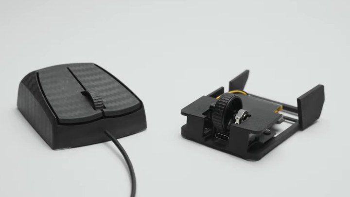 OptimumTech's Zeromouse alongside a regular mouse.
