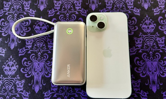 Anker Nano 30W Power Bank with USB-C in green with a green iPhone 15.