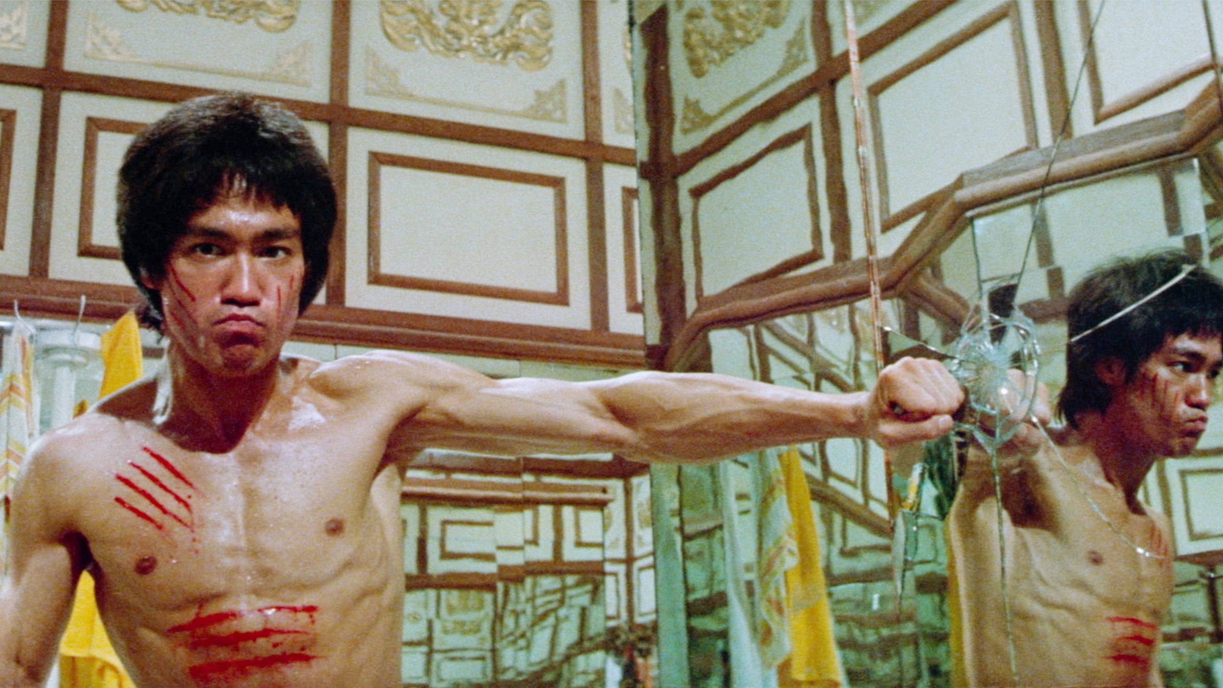 Bruce Lee punches a mirror in Enter the Dragon.