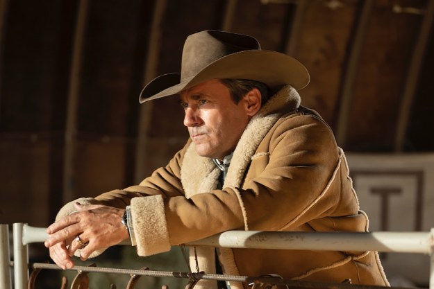 Jon Hamm in a sheriff's cowboy hat standing at a fence in a scene from Fargo season 5.
