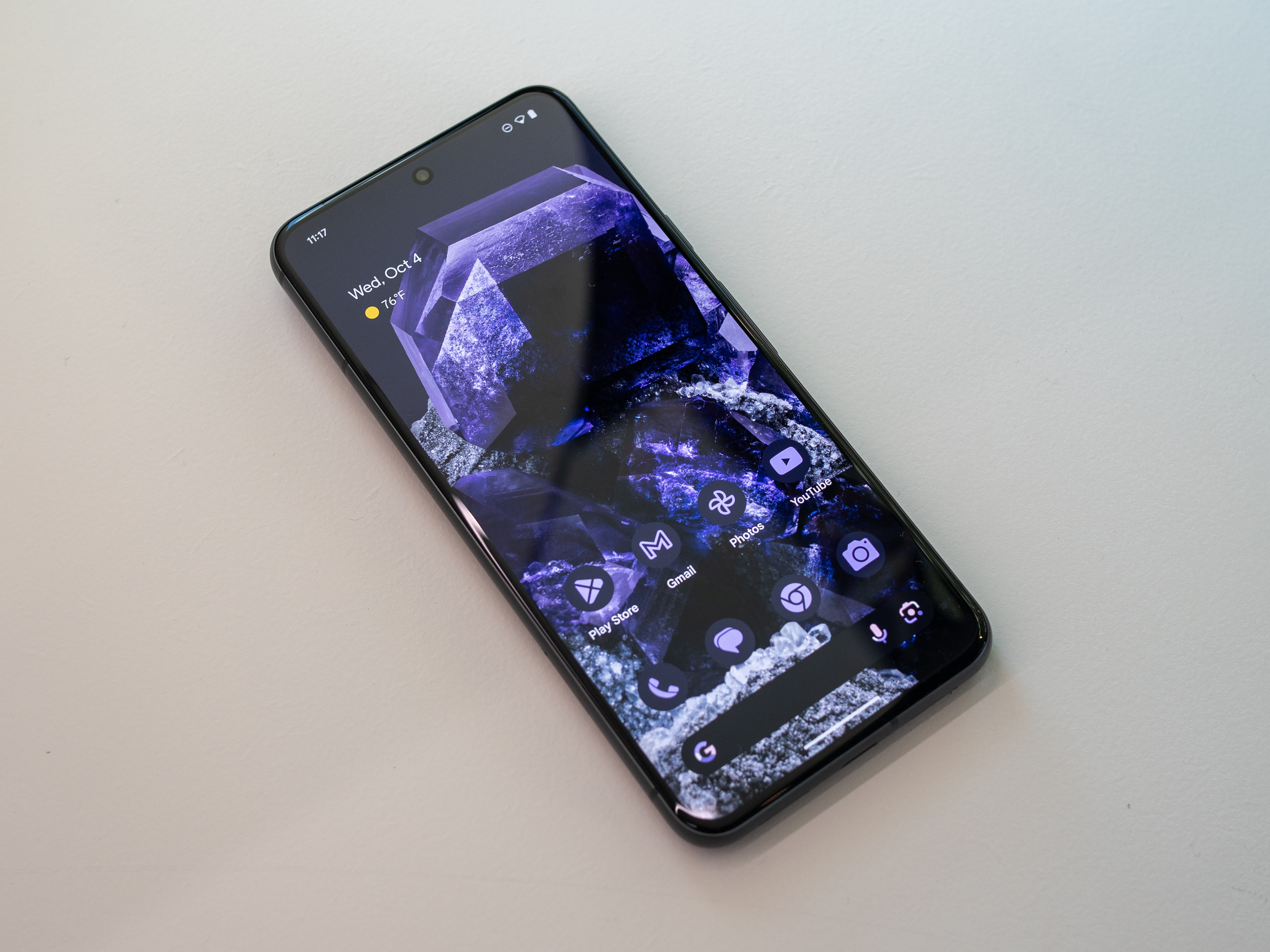 The Google Pixel 8 with its display on.