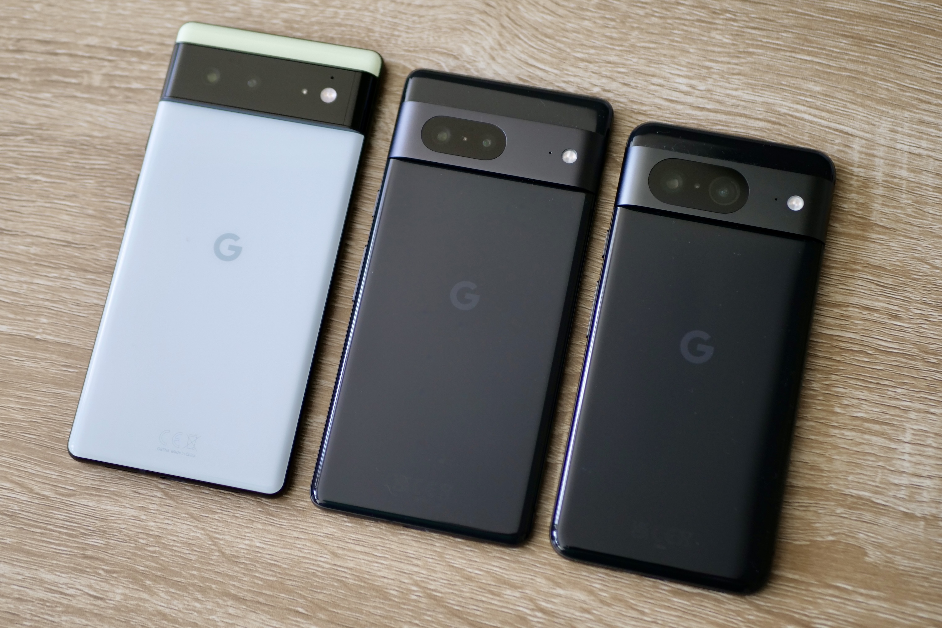 The Google Pixel 8 with the Google Pixel 7 and Pixel 6.
