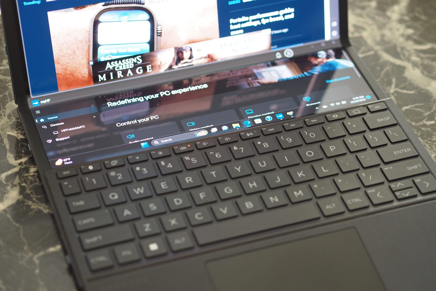 HP Spectre Foldable PC top down view showing keyboard and dual display.