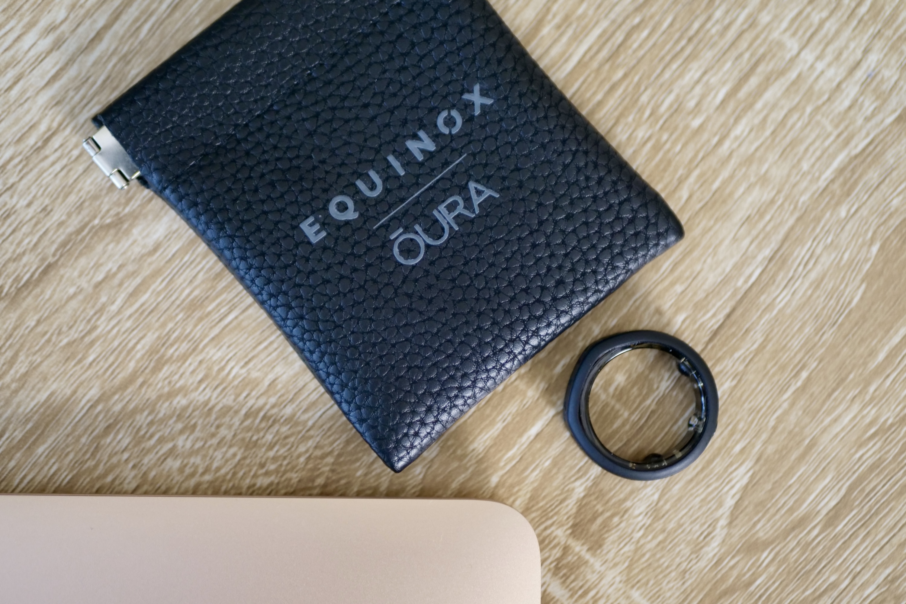 The Oura Ring in the Equinox Ring Cover, with the accessory pouch.
