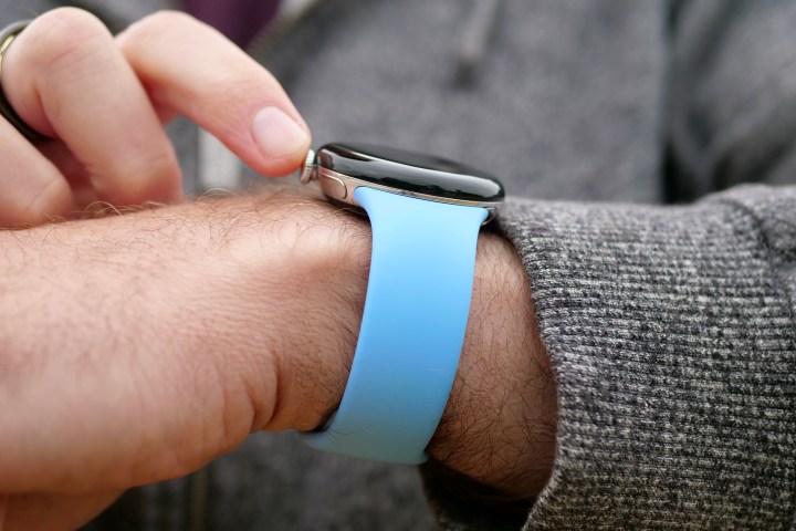 A person using the digital crown on the Google Pixel Watch 2.