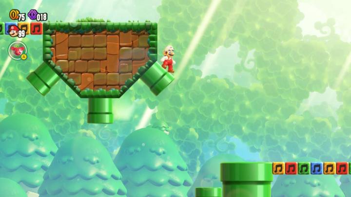 Mario is standing on top of a pipe in Super Mario Bros. Wonder.